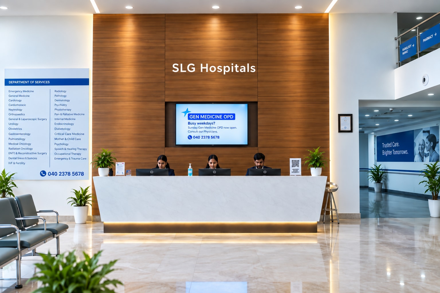 The reception desk in the main lobby at SLG Hospitals, with the department directory and the appointments number beside it.