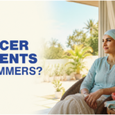 Cancer patient drinking water indoors while staying cool during summer treatment.